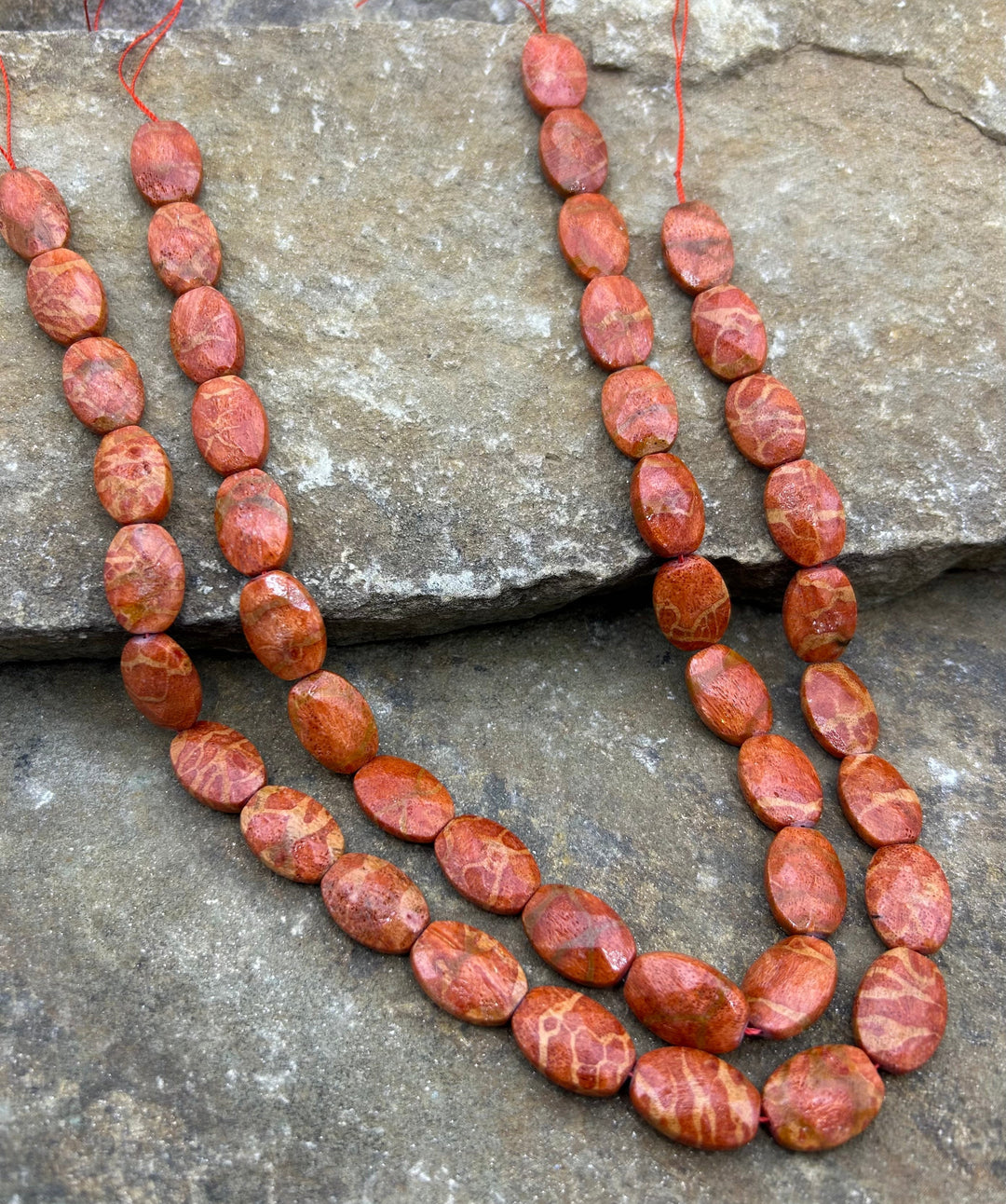 Apple Coral Faceted Oval Beads 12x20mm 16 inch strand