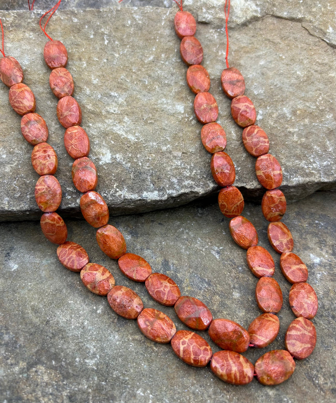 Apple Coral Faceted Oval Beads 12x20mm 16 inch strand