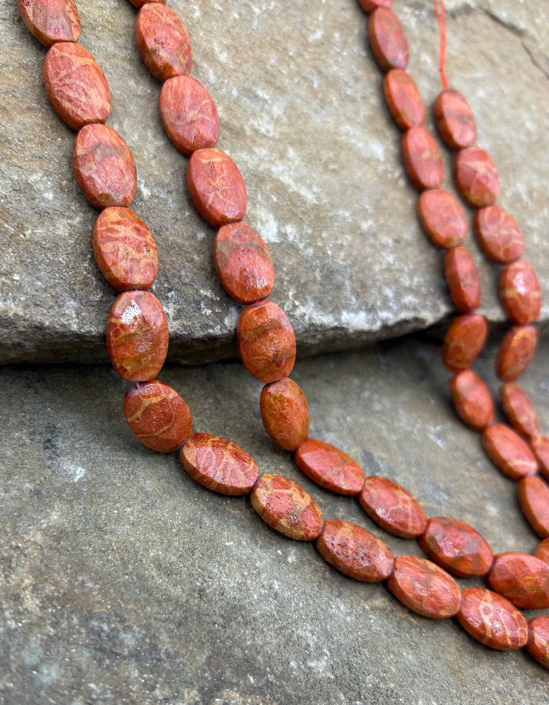 Apple Coral Faceted Oval Beads 12x20mm 16 inch strand