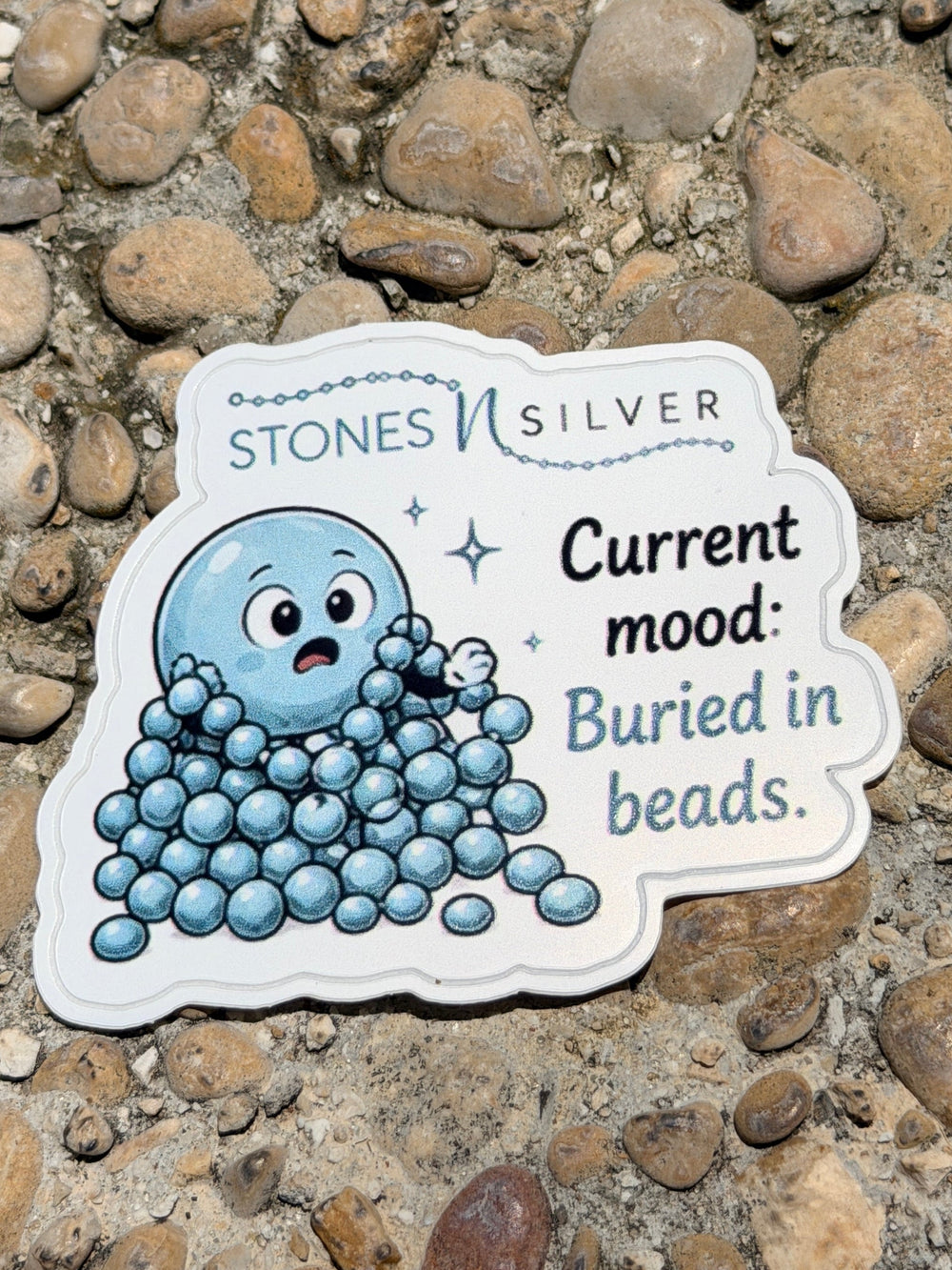 ’Current mood: Buried in Beads.’ Sticker 2.5 inches - merch