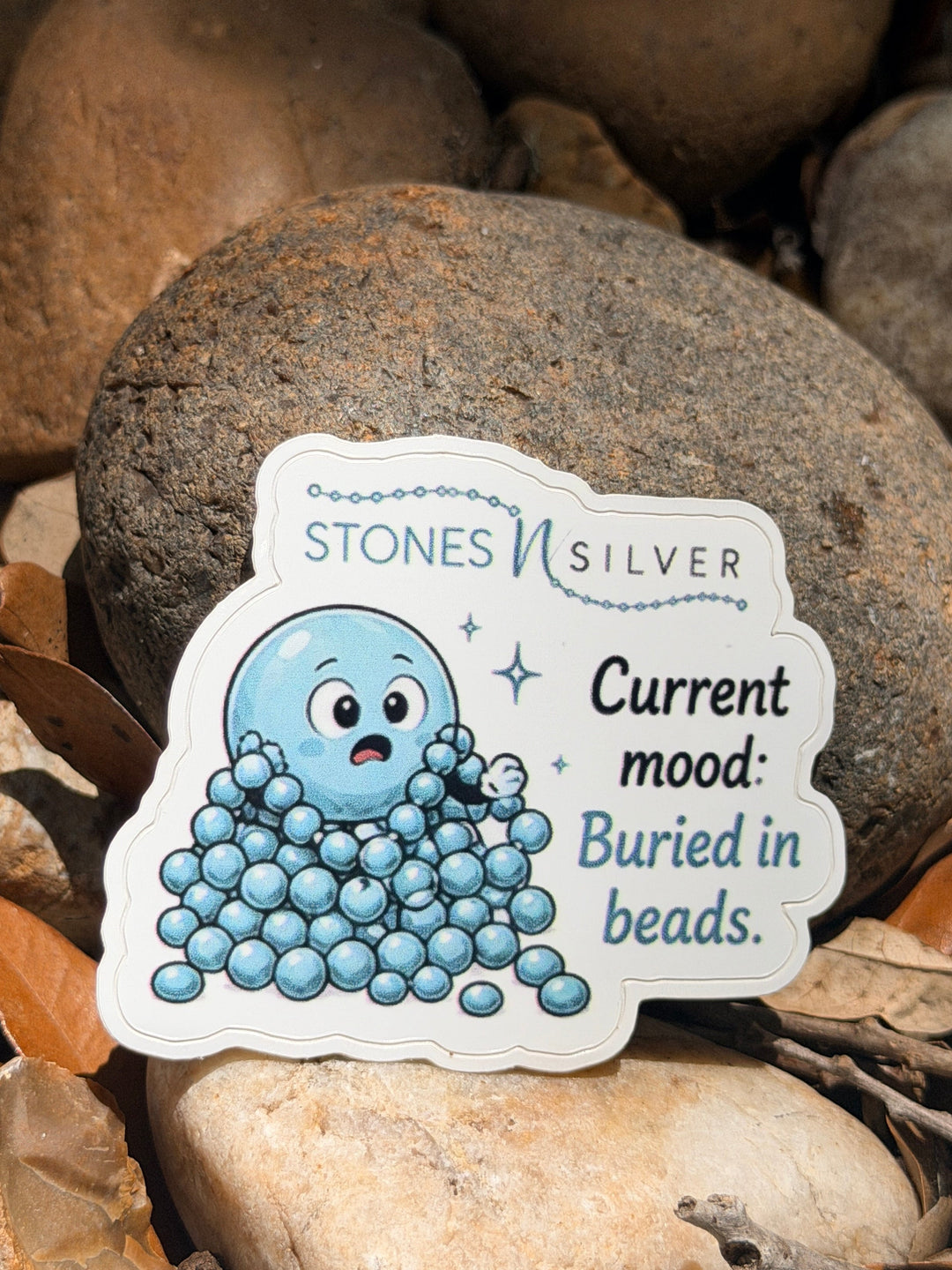 ’Current mood: Buried in Beads.’ Sticker 2.5 inches - merch