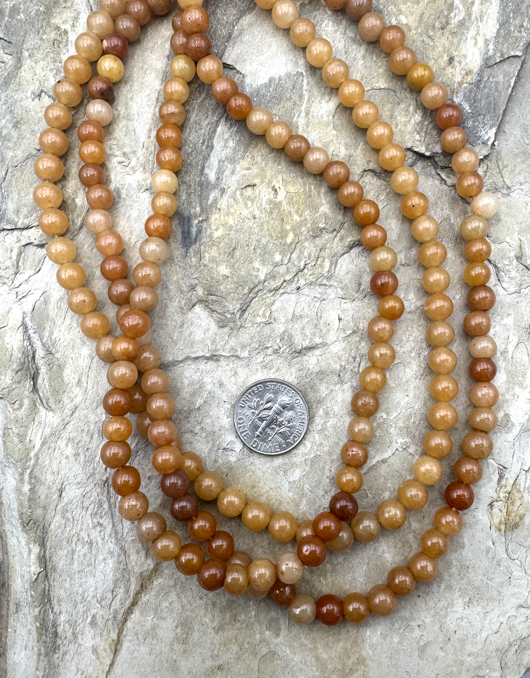 Sunstone (Canada) 7mm Round Beads 15.5 Inch Strand